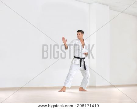 Male karate instructor training in dojo