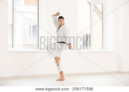 Male karate instructor training in dojo