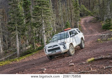 Villa Grove, CO, USA - September 16, 2017: Toyota 4Runner SUV (2016 Trail Premium Edition) on a steep  Hayden Pass Road in Sangre de Cristo Mountains, the southernmost subrange of the Rocky Mountains,