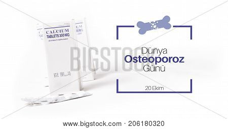 Calcium supplement pill with text of Dunya Osteoporoz Gunu (Turkish translation of World Osteoporosis Day)