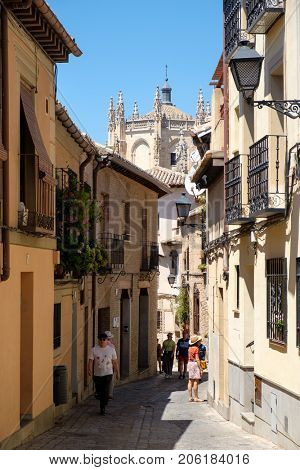 TOLEDO,SPAIN - AUGUST 8,2017 : Typical narrow street on the medieval city of Toledo in Spain