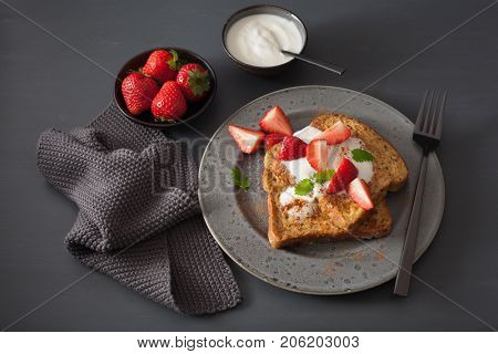 french toasts with yogurt and strawberries for breakfast