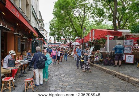 PARIS,FRANCE - JULY 31,2017 : Typical restaurants and artists selling their paintings at the Place du Tertre in Montmartre
