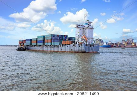 Container ship on the Yangon river near Yangon in Myanmar