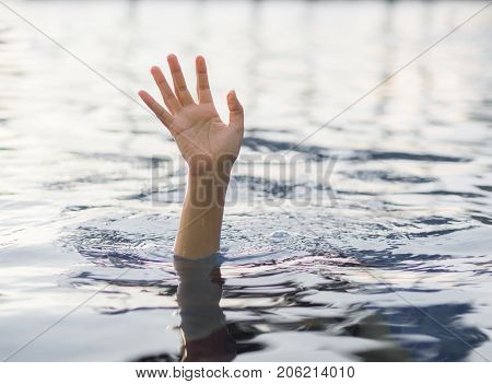 Drowning victims Hand of drowning woman needing help. Failure and rescue concept.