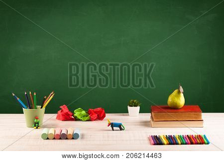 Back to school concepty with clear blackboard background, desk, items