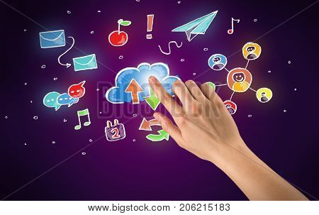 Female hand toucing mixed media icons with purple background