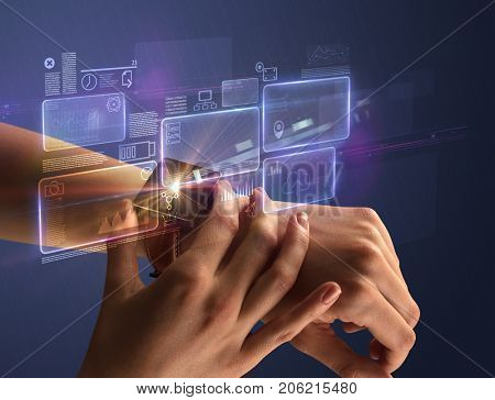 Female hand wearing smartwatch with statement labels around and dark background