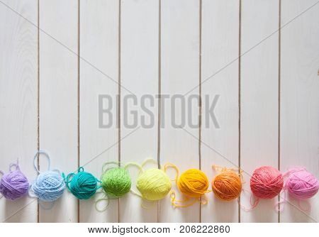 Balls Of Colored Yarn. View From Above. All The Colors Of The Rainbow. Sample Knit. Crochet.