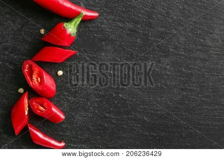 Sliced red chili pepper on gray background