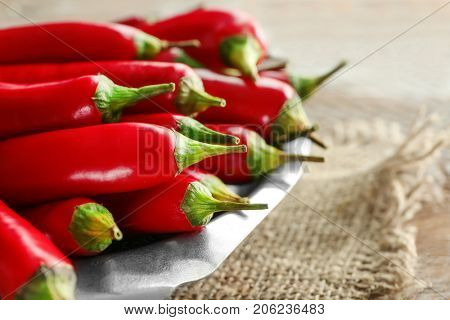 Plate with red chili peppers, closeup