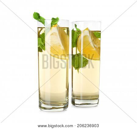 Two glasses with mint julep on white background