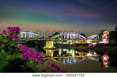 Ratsadapisek bridge at the wang river in the city of Lampang in North Thailand,