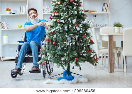 Injured disabled man celebrating christmas at home