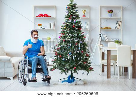 Injured disabled man celebrating christmas at home