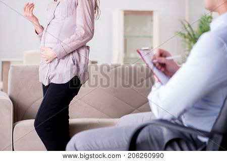 Pregnant woman visiting psychologist doctor