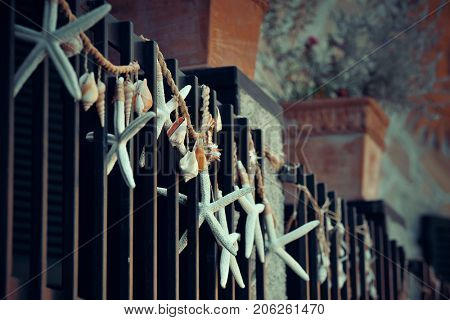 Monterosso street view with decoration on fense in Cinque Terre in Italy 