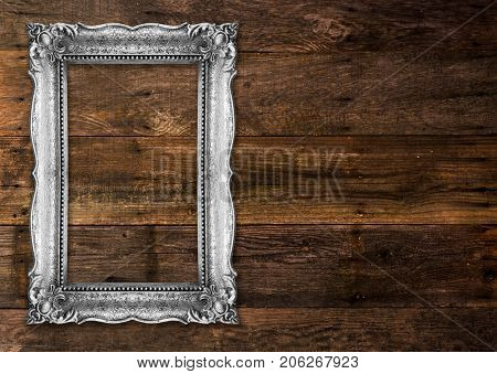 Old Silver Picture Frame on wood baclground