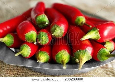 Plate with red chili peppers, closeup