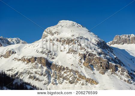 Alpine winter mountain landscape. French Alps covered with snow in sunny day. Val-d'Isere, France