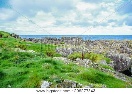 Landscape of Peel Hill rocky seashore in Isle of Man