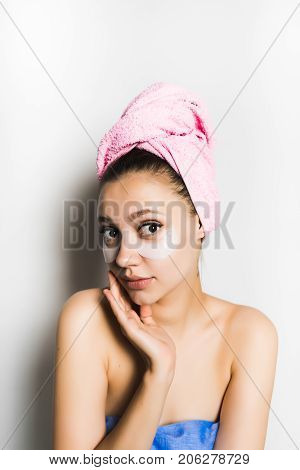Girl with gel mask under the eyes