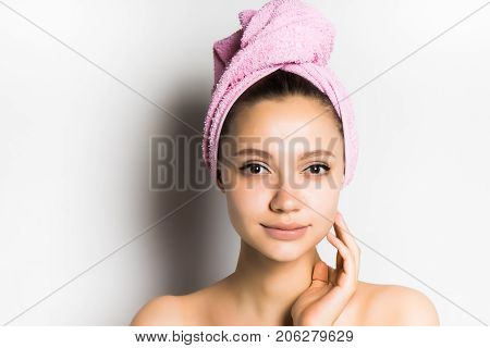 The girl looks after the skin, touches the face. Skin care