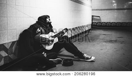 Homeless Couple Man Playing Guitar Asking For Money Donation