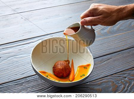 Dumpling of old cowtail with creamy carrot and its juice