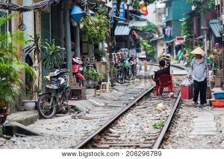 HANOI VIETNAM - AUGUST 2017: Life of people who live near the railway in Hanoi ancient town.
