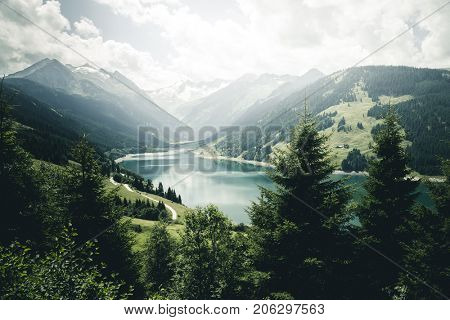 Awesome image of the Durlassboden reservoir. Location municipality of Gerlos, Zillertal valley, Austrian states of Tyrol and Salzburg. High Tauern National Park. Beauty world. Instagram toning effect
