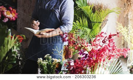 Flowerist working in the flower shop vintage style