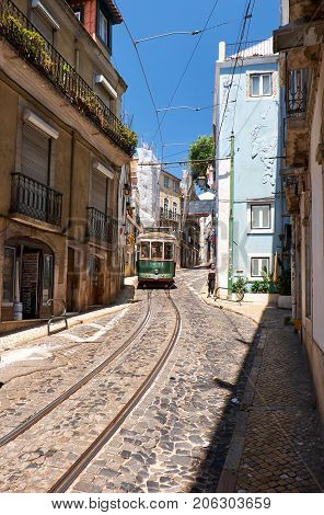 Old Tram Number 28 On The Narrow Street Of Alfama. Lisbon. Portugal