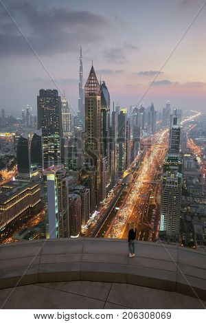 Woman on rooftop, Sheikh Zayed Highway, Burj Khalifa, Rose Rayhaan by Rotana, Ahmed Abdul Rahim Al Attar Tower