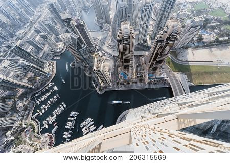 DUBAI, UAE - JAN 20, 2017: (top view) Wall of Cayan Tower in Dubai Marina area, Cayan is tallest building in world, which is twisted by 90 degrees
