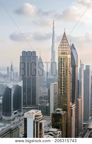 DUBAI, UAE - JAN 8, 2017: Burj Khalifa, Rose Rayhaan by Rotana, Ahmed Abdul Rahim Al Attar Tower 
