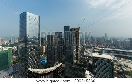CHINA, SHENZHEN - AUG 27, 2015: City skyscrapers, view from Futian Road, According to UN, Shenzhen (with 10 million people) is among top five cities in world in terms of population growth rate