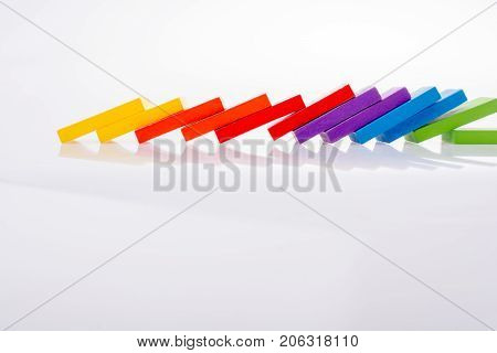 Colorful Domino Blocks in a line on a white background