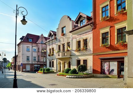 CHRZANOW POLAND - AUGUST 19 2017: Colorful buildings and shops in the city center of Chrzanow Poland.