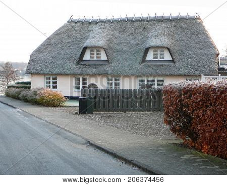 Graasten Denmark - December 23 2007: Thatched House on Winter day in Graasten Denmark