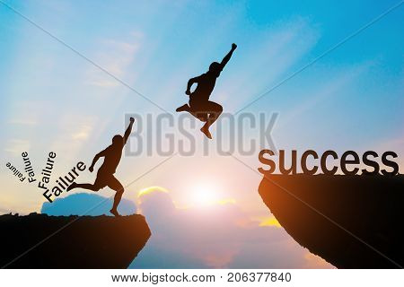 Men jump over silhouette failure Committed to success.