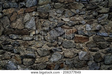Gray stone wall. Stone background. Stone texture.Old stone style. Grunge stone. Grunge grey stone background. Fragment of wall of an old fortification in Ust-Kamenogorsk. Stone gray background.