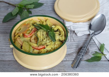Yellow Thai Curry In A Bowl On Wooden Table