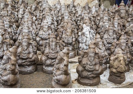 Many hand crafted Ganesha idol clay statues displayed in the market during Ganesh Festival.