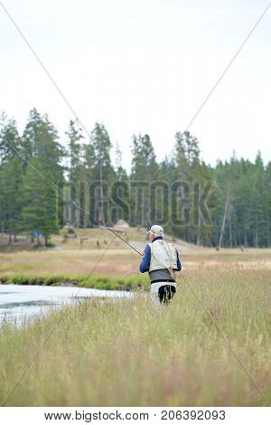 Fly-fisherman fishing in the Gallatin River, Montana