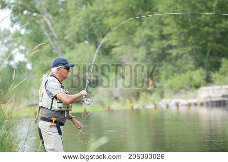 Fly-fisherman fishing in the Gallatin River, Montana