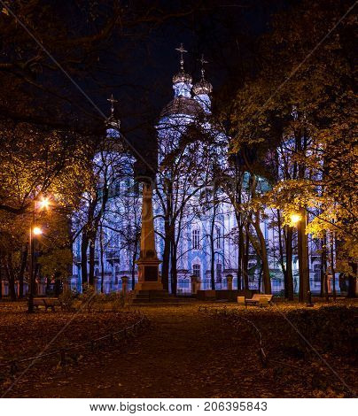Night autumn view of illuminated St. Nicholas Naval Cathedral and Nikolskiy garden St. Petersburg Russia