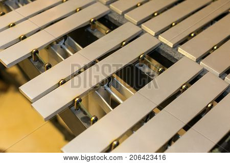 xylophone, musical percussion instruments concept - closeup on glockenspiel, marimba, balafon, semantron, pixiphone, education and orchestra concert usage, beige bars without mallets
