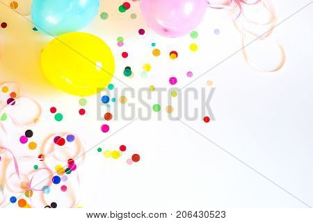 Festive party or carnival confetti on pink background