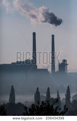 Power station with smoking chimney symbol of environmental pollution